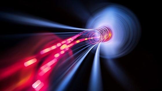 Streams of red light converging into a bright tunnel