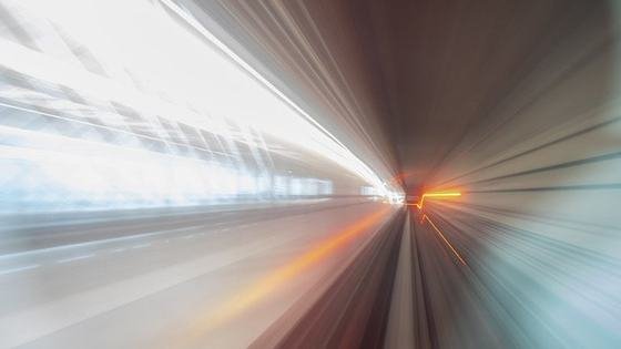 Motion blur through a bright transit tunnel