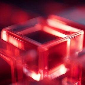 Translucent red cubes stacked in soft light