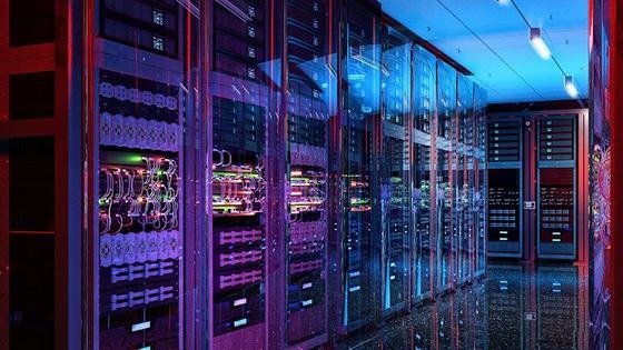 Rows of illuminated server racks in a data hall