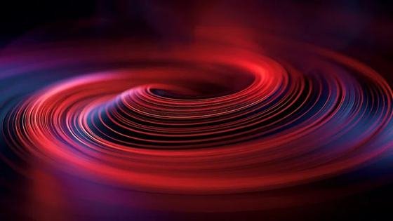 Red light spiralling into a vortex